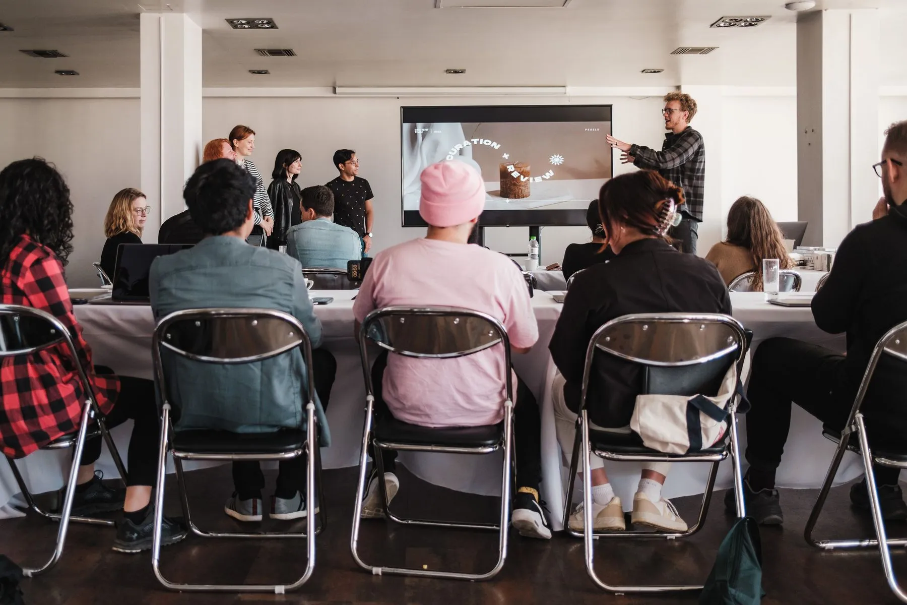 A speaker presenting to a professional audience